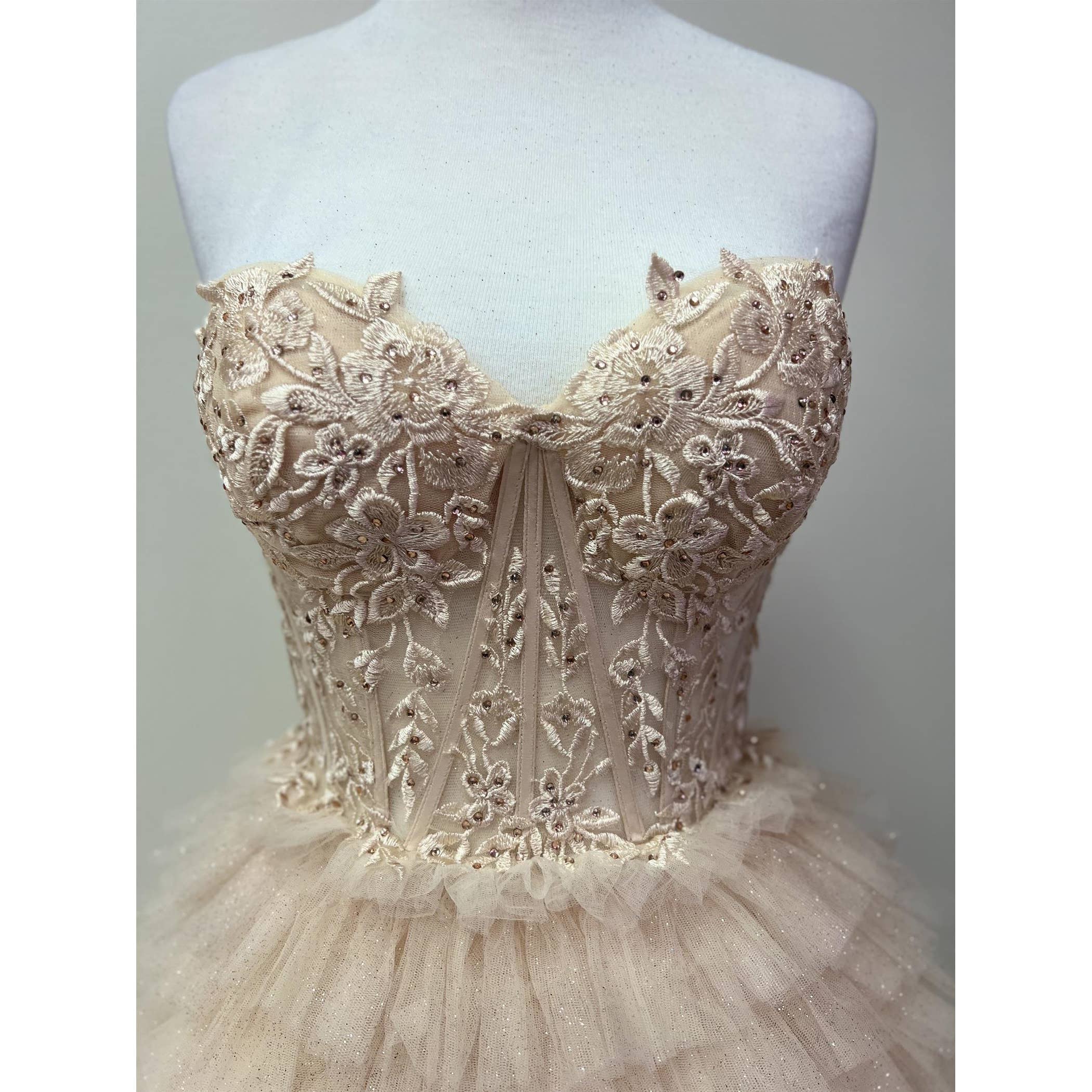 STRAPLESS COCKTAIL GOWN WITH LEAF LACE CORSET BODICE AND RUF